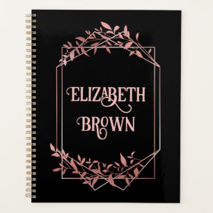 Elegant rose gold frame leaves black planner