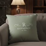 Elegant Sage Monogram Throw Pillow<br><div class="desc">Bring warmth and elegance to your home with this customisable sage green throw pillow. Easily personalise with your monogram, family name, and est. date, making it a meaningful accent for your living room, bedroom, or entryway. The soft sage green backdrop offers a soothing, contemporary feel that complements a variety of...</div>