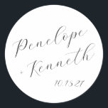 Elegant Script Calligraphy White Wedding Custom  Classic Round Sticker<br><div class="desc">This contemporary wedding sticker features a minimalist horizontal composition and the bride and groom names in a stylish script calligraphy in black on a white background.</div>