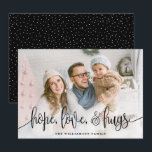 Elegant Script Full Photo Hope Love Hugs Black Holiday Card<br><div class="desc">Send love this season to your family and friends with these modern styled cards by Orabella Prints. Elegant text overlay reads, "hope, love, & hugs" in black over a white gradient overlay on the bottom of the card. The back features tiny white snow dots over a black background, which can...</div>