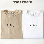 Elegant Script Hubby and Wifey Wedding Newlyweds T-Shirt<br><div class="desc">Celebrate love in style with this Personalised Hubby & Wifey T-Shirt, featuring elegant simple script calligraphy for a clean, timeless look. Perfect for couples who love minimalist fashion with a romantic touch, this shirt is designed for memorable moments before and after the big day. Ideal as a bridal shower gift,...</div>