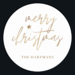 Elegant Script Merry Christmas Gold Star White Classic Round Sticker<br><div class="desc">These stylish Christmas holiday stickers feature elegant typography reading,  "Merry Christmas" in faux gold foil,  along with a little star accent. The background colour can be customised to any colour you'd like! Great for use as envelope seals,  party favour labels,  or gift sticker labels!</div>