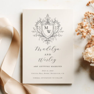 Elegant script monogram crest  save the date