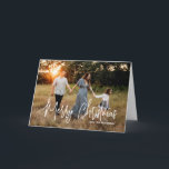 Elegant Script Photo Modern Christmas Holiday Card<br><div class="desc">Modern photo Christmas card featuring a simple and minimal design with the greeting "Merry Christmas" in an elegant white script along with your family name.  The inside has a photo collage consisting of six square pictures.</div>