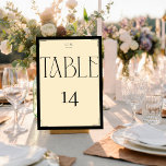 Elegant Serif Black Cream Monogram Table Number<br><div class="desc">Make a grand statement at your next event with these Art Deco-inspired table cards, showcasing a striking contrast of black and beige. The captivating script font for 'TABLE' and the bold number '14' exude vintage charm and sophistication. These cards are designed not only to direct your guests but also to...</div>