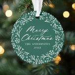 Elegant Snowflake Wreath Green Christmas Photo Ornament<br><div class="desc">Elegant holiday photo ornament featuring "Merry Christmas" displayed in a white calligraphy script encircled by a wreath of snowflakes and pine branches on a green background. Personalise the front of the ornament by adding your family name and the year. The back of the ornament features your favourite family photo making...</div>