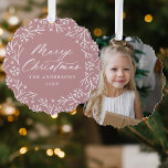 Elegant Snowflake Wreath Rose Photo Christmas Tree Decoration Card<br><div class="desc">Elegant holiday photo ornament card featuring "Merry Christmas" displayed in a white calligraphy script encircled by a wreath of snowflakes and pine branches on a dusty rose background. Personalise the front of the ornament card by adding your family name and the year. The back of the paper ornament features your...</div>