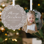 Elegant Snowflake Wreath Taupe Photo Christmas Tree Decoration Card<br><div class="desc">Elegant holiday photo ornament card featuring "Merry Christmas" displayed in a white calligraphy script encircled by a wreath of snowflakes and pine branches on a taupe background. Personalise the front of the ornament card by adding your family name and the year. The back of the paper ornament features your favourite...</div>