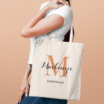 Elegant Terracotta Monogram Bridesmaid Tote Bag<br><div class="desc">Rich and warm, this elegant tote features a terracotta monogram initial with a personalised name in earthy script and the bridal party role below. A stunning monogram keepsake that captures the warmth of desert sunsets and pairs perfectly with boho, fall, and earth-toned wedding palettes. Name, initial, and role are fully...</div>