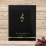 Elegant Treble Clef Music 2025 Yearly Planner<br><div class="desc">This simple and elegant black yearly planner features a treble clef in faux gold. Perfect for music teachers,  music school offices,  musicians,  music lovers and more. Customise it with your own details and utilise the editing tool to make further adjustments,  such as font size and placement.</div>