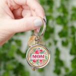 Elegant Watercolor Floral "MOM I Love You" Mother' Key Ring<br><div class="desc">The design on the medallion is highly visual and features a vibrant floral theme with a gold-toned inner border. Imagery: The background is a mix of pink and white, adorned with lush pink roses and green leaves. Text: A white rectangular banner is overlaid in the center, containing the text "MOM"...</div>