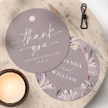 Elegant White Lily Wedding Thank You Tag<br><div class="desc">Add a special touch to your wedding favours and gifts with these elegant thank-you tags. Featuring delicate white lilies on a soft taupe background, they bring a refined and romantic feel to any celebration. The back includes a graceful "Thank You" message, making them perfect for wedding receptions, bridal showers, and...</div>