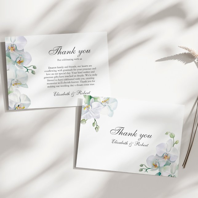 Elegant White Orchid Wedding Thank You Card (Elegant White Orchid Wedding Thank You Card on a sunny elegant white table.)