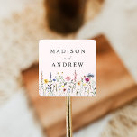 Elegant Wildflower Meadow Blush Pink Wedding Square Sticker<br><div class="desc">Elegant floral wedding stickers featuring a bottom border of watercolor wildflowers and foliage in shades of pink, yellow, purple, blue, and green with a blush pink background. Personalise the wildflower wedding stickers with your names or custom text. The personalised wildflower wedding stickers are perfect for sealing wedding envelopes, favour bags,...</div>