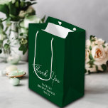 Emerald Green Minimalist Bridal Shower Thank You Medium Gift Bag<br><div class="desc">Make a lasting impression with this elegant emerald green gift bag that perfectly matches your bridal shower theme. The minimalist design featuring the bride's name and wedding date adds a heartfelt personal touch as your guests take home their bridal shower favours.</div>