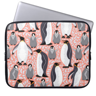 Emperor penguins and their cubs on a pink patterne laptop sleeve