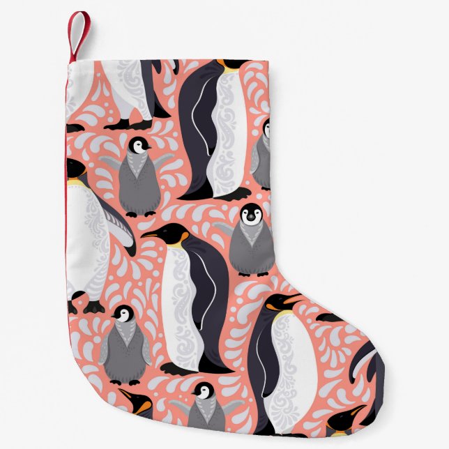 Emperor penguins and their cubs on a pink patterne small christmas stocking (Front)