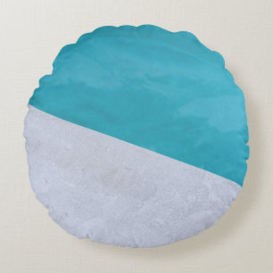 Empty gray floor beside pool round cushion