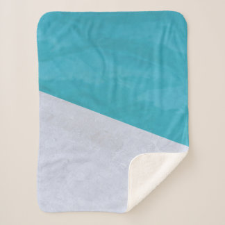 Empty grey floor beside pool sherpa blanket