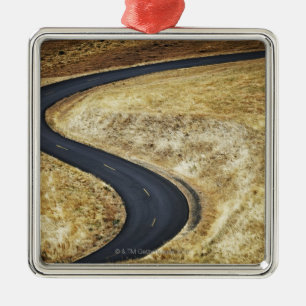 Empty winding paved road metal ornament