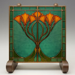 Enchanted Blossom Stained Glass  Ceramic Tile<br><div class="desc">Transform your living space with the Enchanted Blossom Stained Glass Ceramic Tile, a captivating piece printed by Zazzle. This flat ceramic tile, designed with no embossed features, exudes the charm of Art Nouveau with its intricate stained glass effect. The design features an elegant arrangement of orange blossoms, gracefully intertwined against...</div>