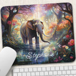 Enchanted Forest Elephant Personalised Mouse Pad<br><div class="desc">Transform your workspace into a magical sanctuary with this personalised mouse pad featuring an enchanting elephant amidst a mystical forest. The gentle giant, adorned with intricate details and surrounded by vibrant flora, creates a captivating scene, inspiring creativity and wonder. Make it truly yours by adding your name or a special...</div>