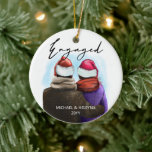 Engaged Script Watercolor Couple and Names Ceramic Ornament<br><div class="desc">Engaged,  personalised christmas tree ornament. This watercolor design has a trendy illustration of a couple wearing santa hats. "Engaged" is hand lettered in modern script and the template is ready for you to add your names and the year. Double sided with the same design on both sides.</div>