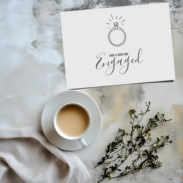 Engagement ring, engaged party announcement (Simple white engaged card with a fun hand drawn style engagement ring on the front)