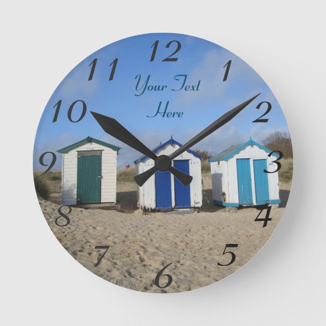 english seaside blue skies and beach huts round clock (Front)