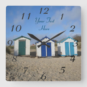 english seaside blue skies and beach huts square wall clock