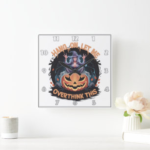 Enigmatic witch pondering atop a pumpkin at dusk square wall clock