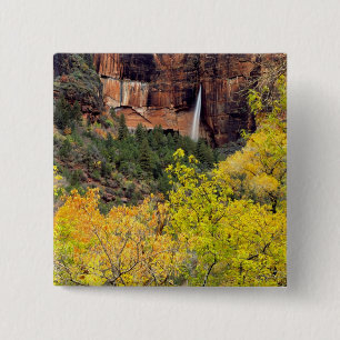 Ephemeral waterfall pours out of slot in cliff 15 cm square badge