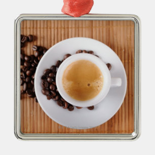 Espresso cup on a mat metal ornament