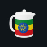 Ethiopia Flag Teapot<br><div class="desc">This Ethiopia Flag Teapot combines functionality with national pride, offering a beautiful way to serve your favourite tea while celebrating the vibrant colours and symbolism of the Ethiopian flag. The teapot features the iconic green, yellow, and red colours of the flag, along with the blue circle and star emblem, making...</div>