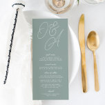 Eucalyptus | Script Watermark Monogram Wedding Menu<br><div class="desc">A beautiful typography based wedding menu card featuring your initials in oversized script lettering at the top, in tone on tone shades for a watermark effect. Personalise with your menu items beneath. Our Eucalyptus colorway is an elegant mix of dusty greens, featuring pale green and white lettering on a sage...</div>