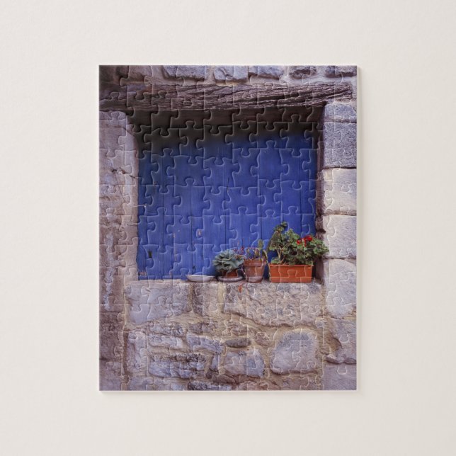 Europe, France, Cereste. A blue door adds colour Jigsaw Puzzle (Vertical)