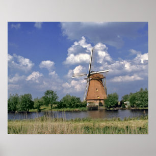 Europe, Netherlands, Kinerdijk. A windmill sits Poster