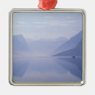 Europe, Norway. Vertical walls reflected in Metal Tree Decoration