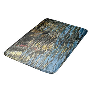 Evening lights on the sea bath mat
