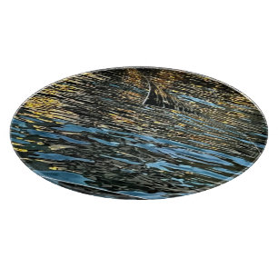 Evening lights on the sea cutting board