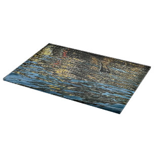 Evening lights on the sea cutting board