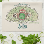 Everything Grows in THE SHIRE™ Tea Towel<br><div class="desc">Bring a little piece of Middle-Earth™ to your everyday with this charming Lord of the Rings™ design inspired by the cozy hills of Hobbiton. Featuring a storybook-style hobbit hole with its iconic round green door tucked into a lush hillside, the artwork is paired with the beloved phrase, “Everything grows in...</div>