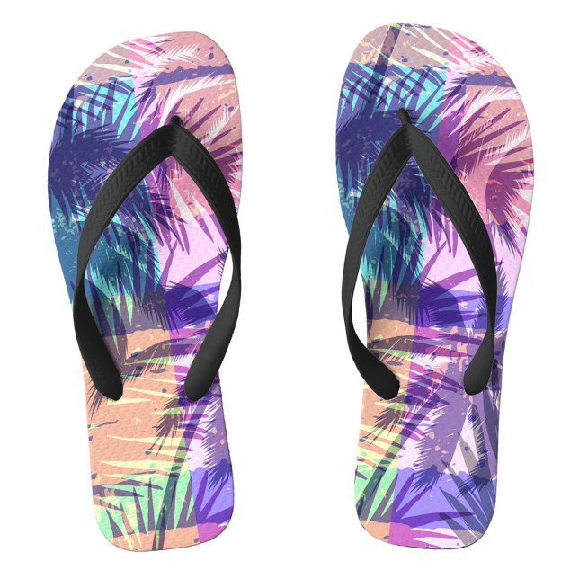 Exotic Thongs (A palm leaf patterns in vivid colors. The background reveals gentle waves lapping at the shore.  )