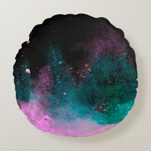 Explosion of colored powder isolated on black back round cushion
