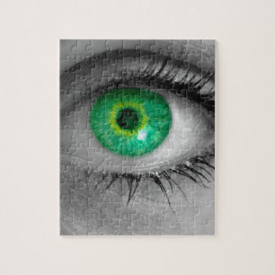Eye with green iris looks at viewer concept macro jigsaw puzzle