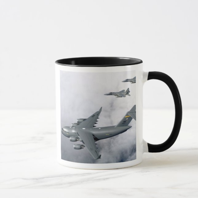 F-15B Eagles escort the first Hawaii-based C-17 Mug (Right)