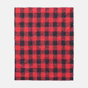 Fabric texture with grid pattern, red squares and fleece blanket