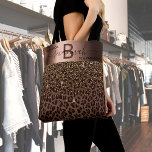 Fabulous birthday leopard pattern brown black tote bag<br><div class="desc">An elegant, glamorous and feminine 50th (or any age) birthday gift. With brown, golden and black leopard pattern, decorated with golden confetti. Personalize and add your name and monogram letter. With the text: 50 & Fabulous (x2) A faux bronze colored band. Black and brown letters. The name is written with...</div>