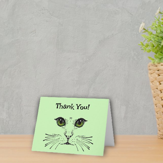 Face of Cat in black Green Eyes Whiskers Thank You Card (Kitty cat face in black with green eyes and whiskers on light green Thank You cards.)