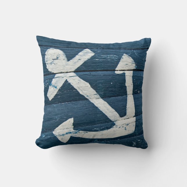 faded nautical anchor on rustic blue cushion (Front)
